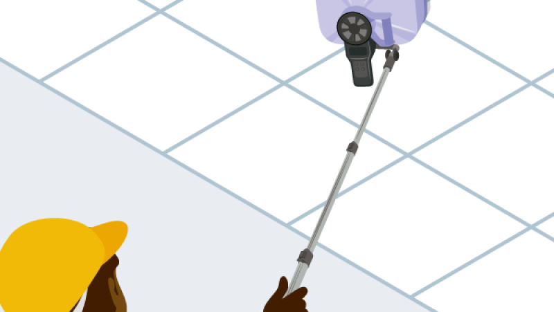 Un anémomètre sur une perche télescopique pour mesurer la vitesse d'air de VMC